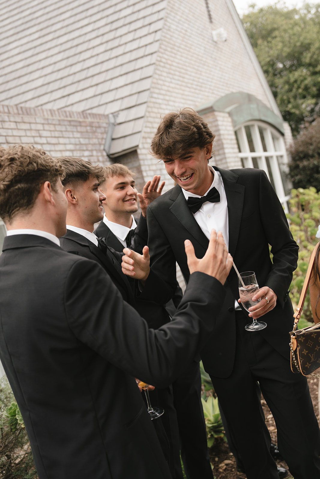 The groom and groomsmen celebrating.
