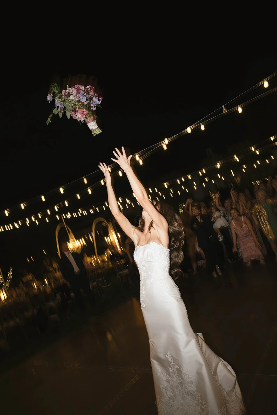  The traditional bouquet toss. Digital. 