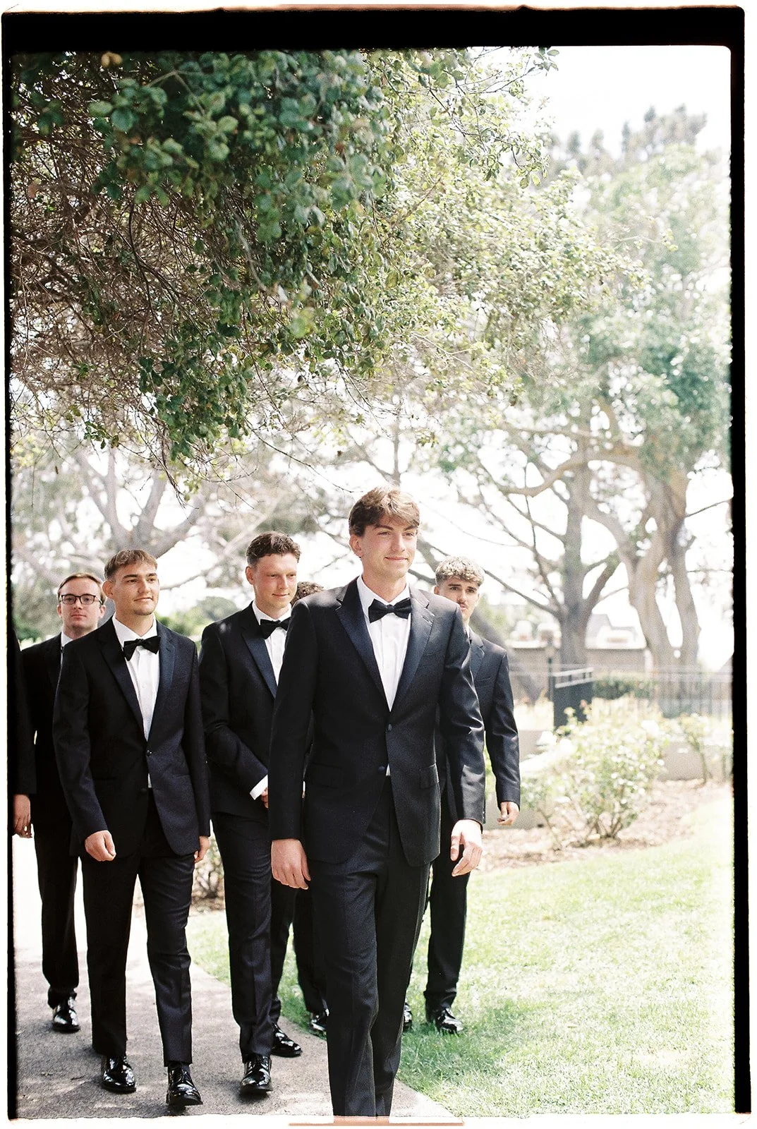 The groom and groomsmen walking