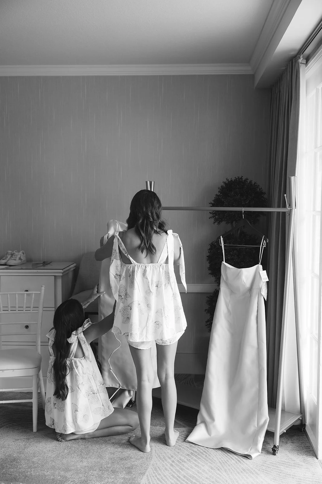 The bridesmaids steaming the gowns