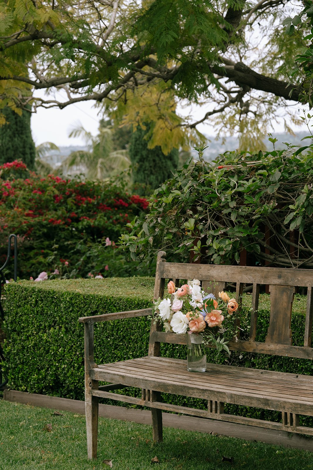 Wedding bouquet sitting quietly on a bench waiting to be shown to the bride.