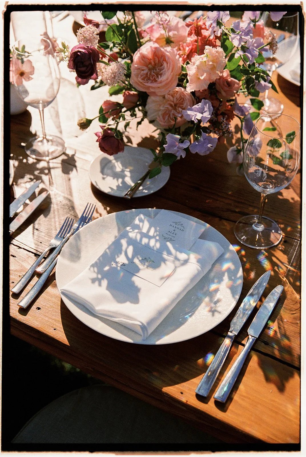  A look at the dinner details: colorful floral arrangements, elegant place cards, and a personalized dinner menu. 