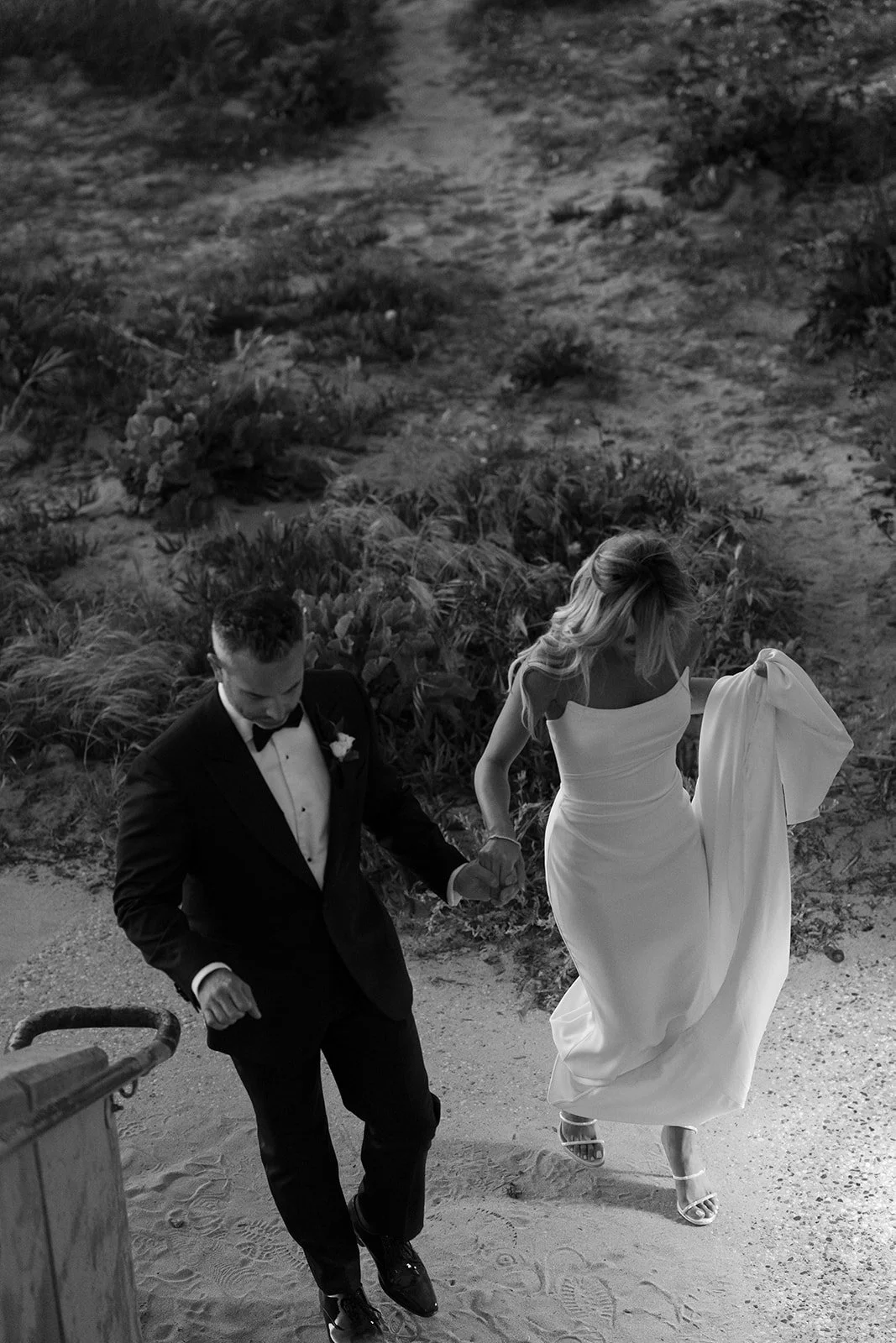 candid couples photos walking modern luxury black and white
