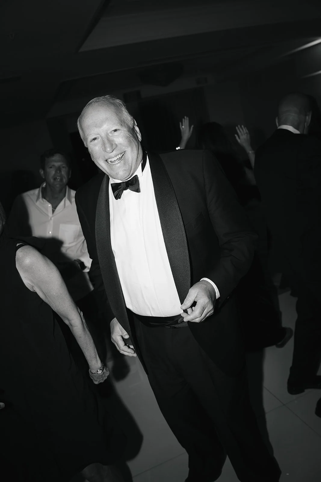 A man smiling at a reception