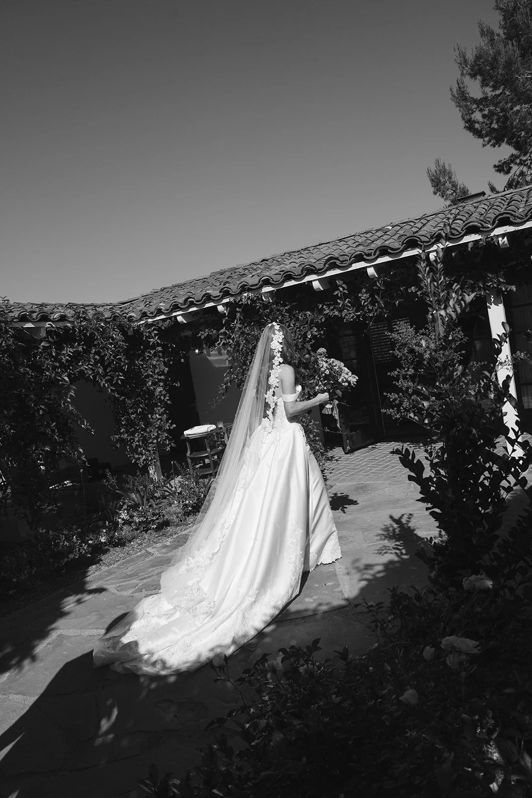  The bride’s veil trailing behind her as she escapes for a private moment with her husband. 
