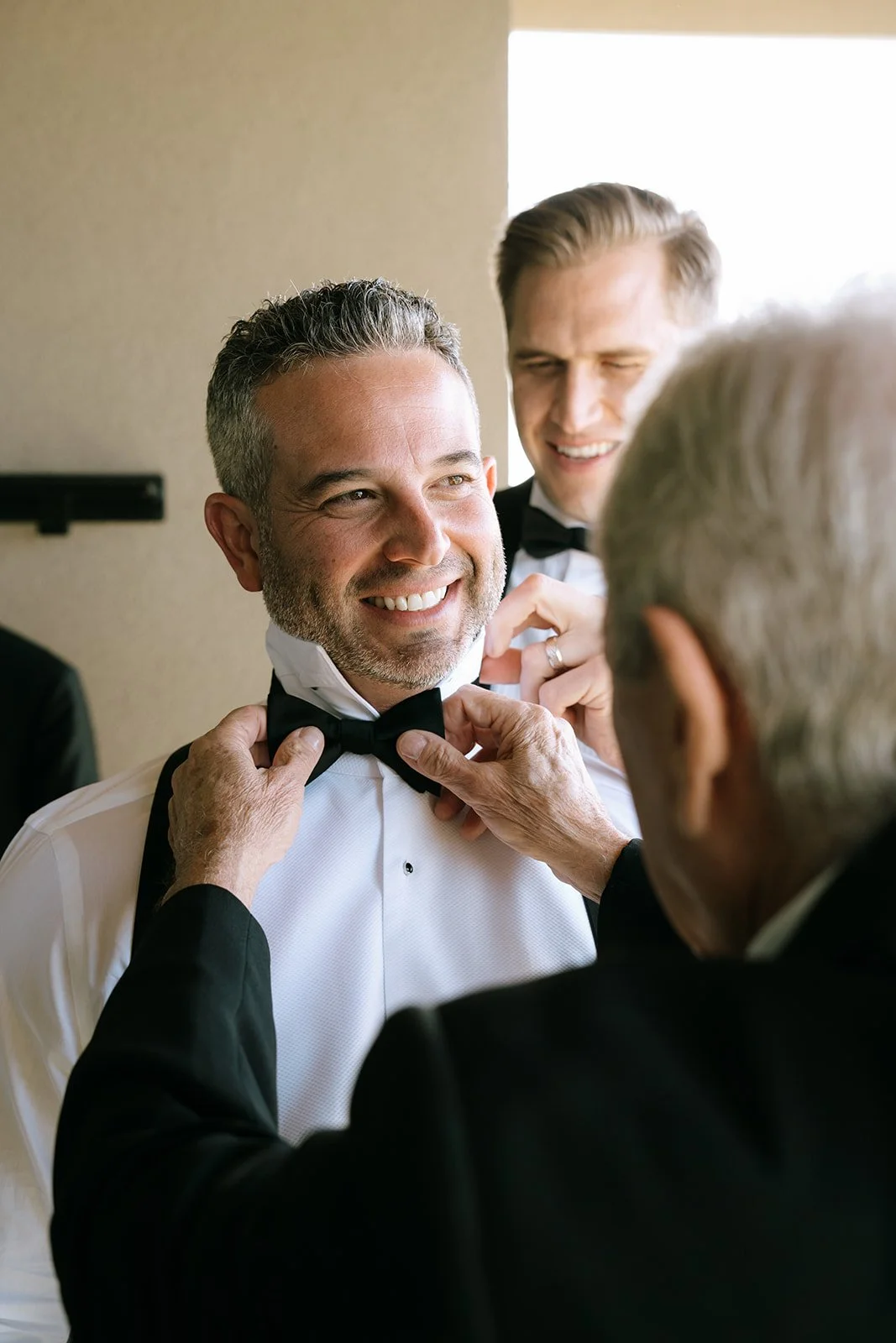 getting ready photos groom modern luxury bowtie
