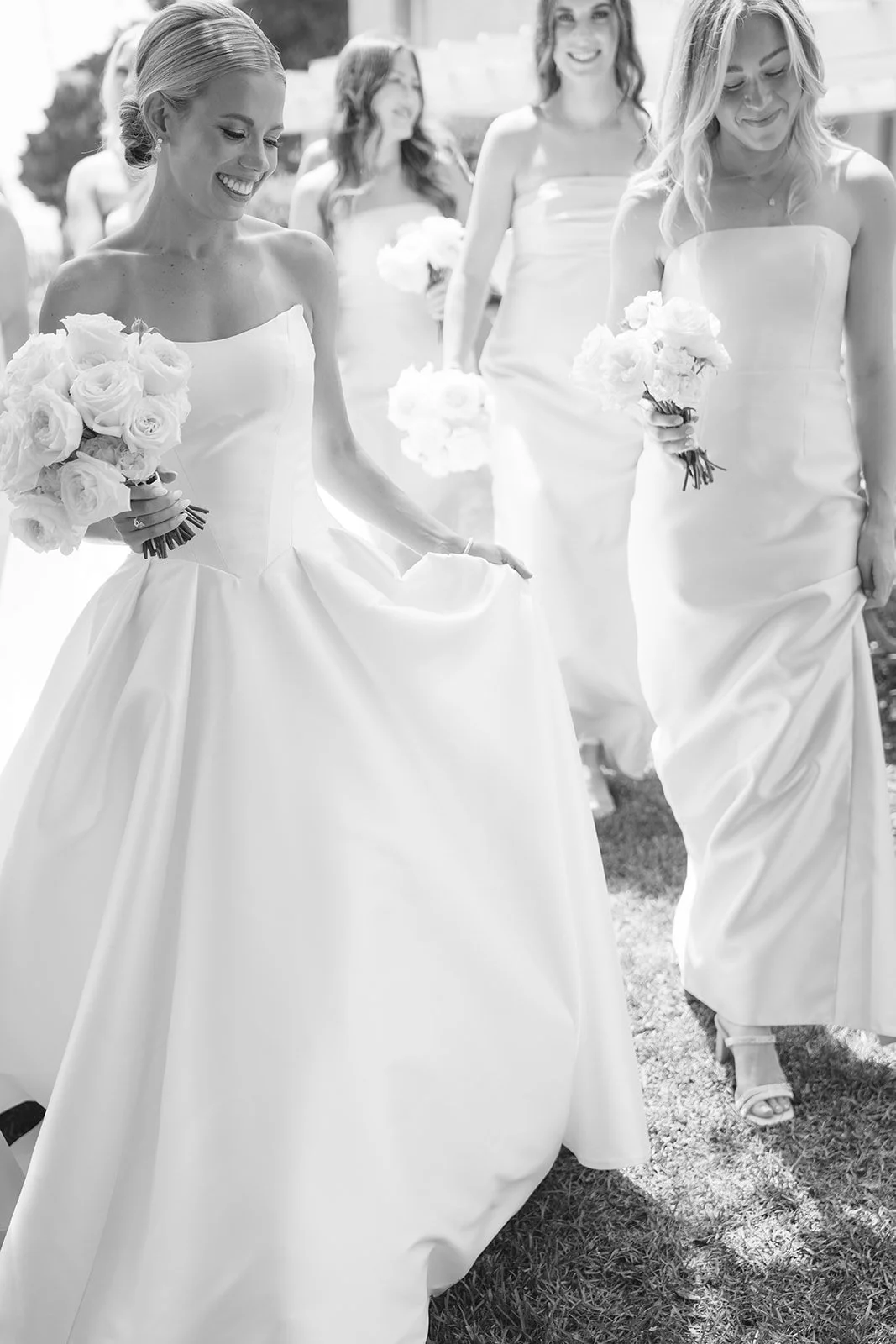 The bride and bridesmaids walking.