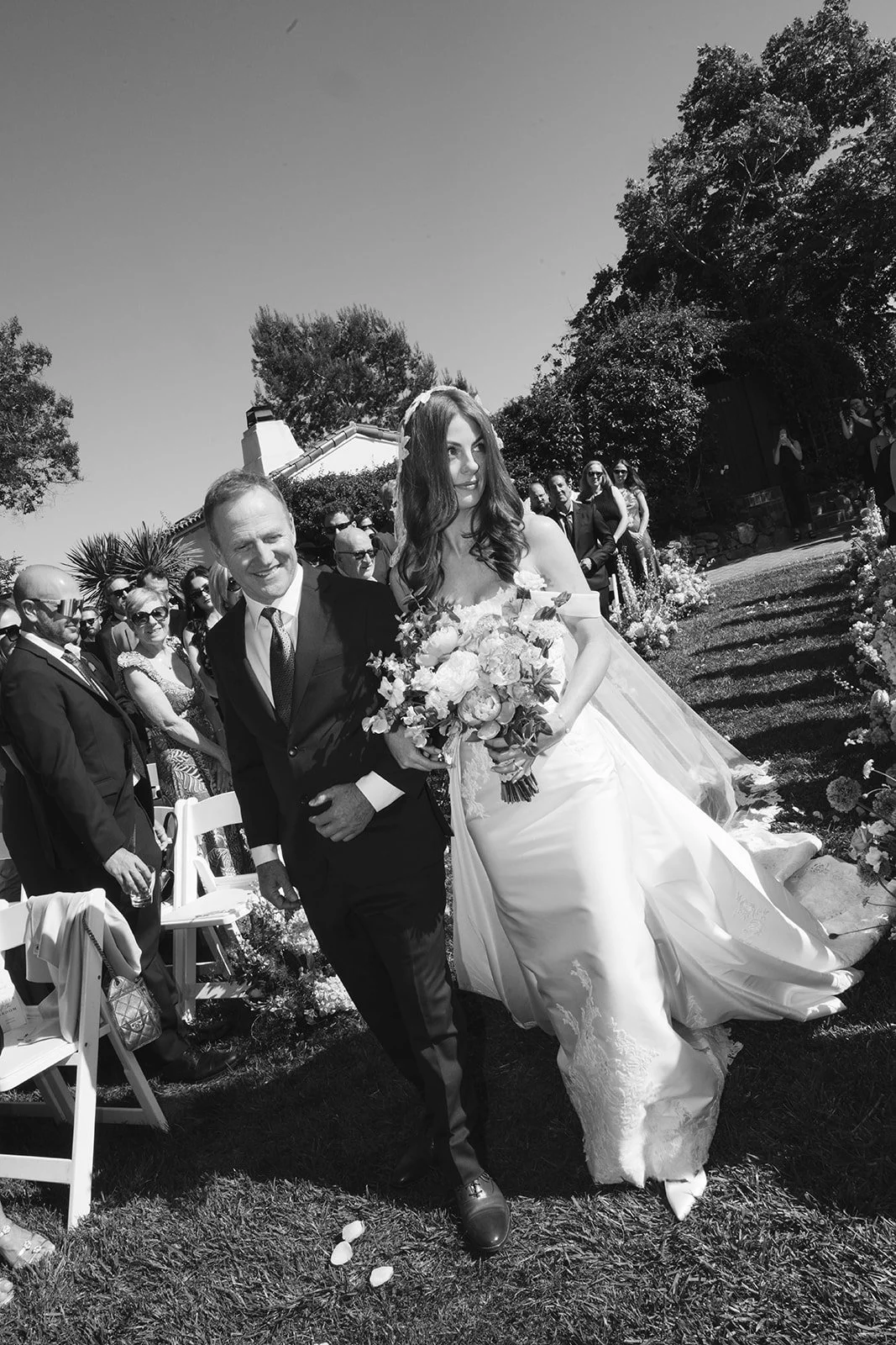  The father of the bride walking the bride down the aisle. Digital. 
