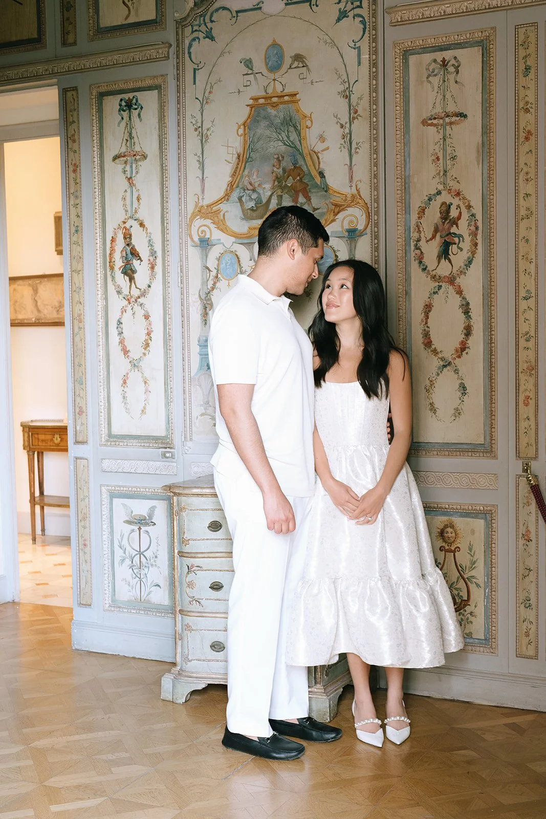 The soon to be bride and groom in the Monkey Fair Room of the Villa Ephrussi during their destination engagement session on the South of France