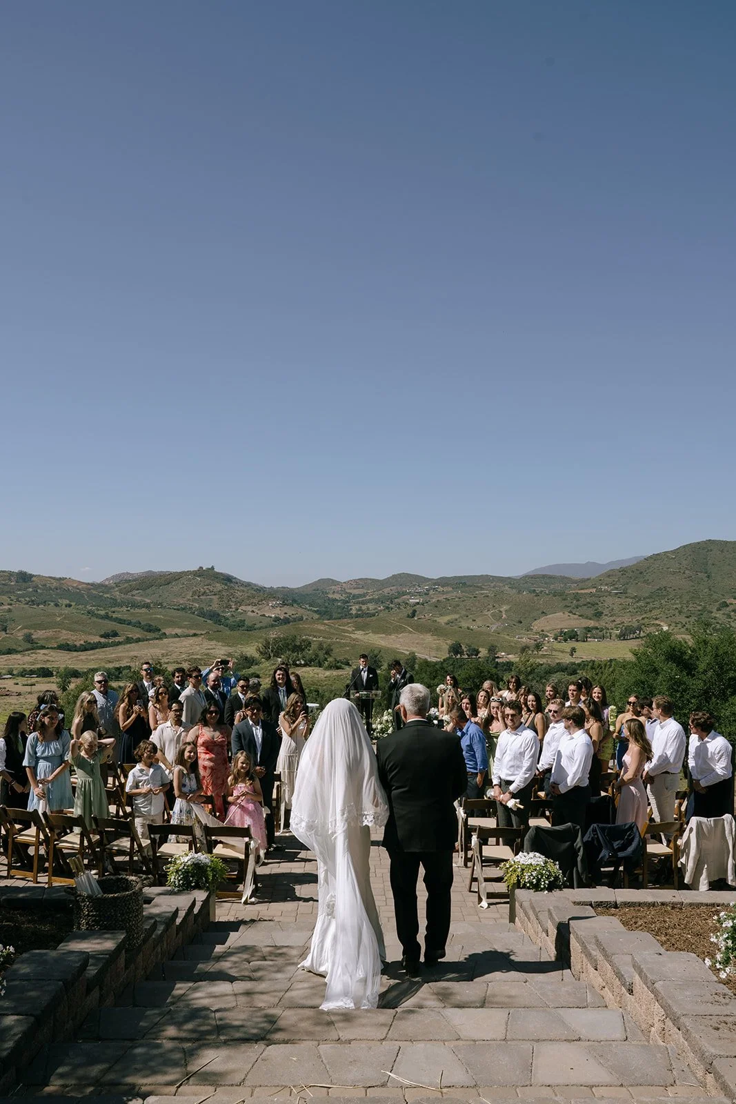 Bride walks down the aisle with dad.