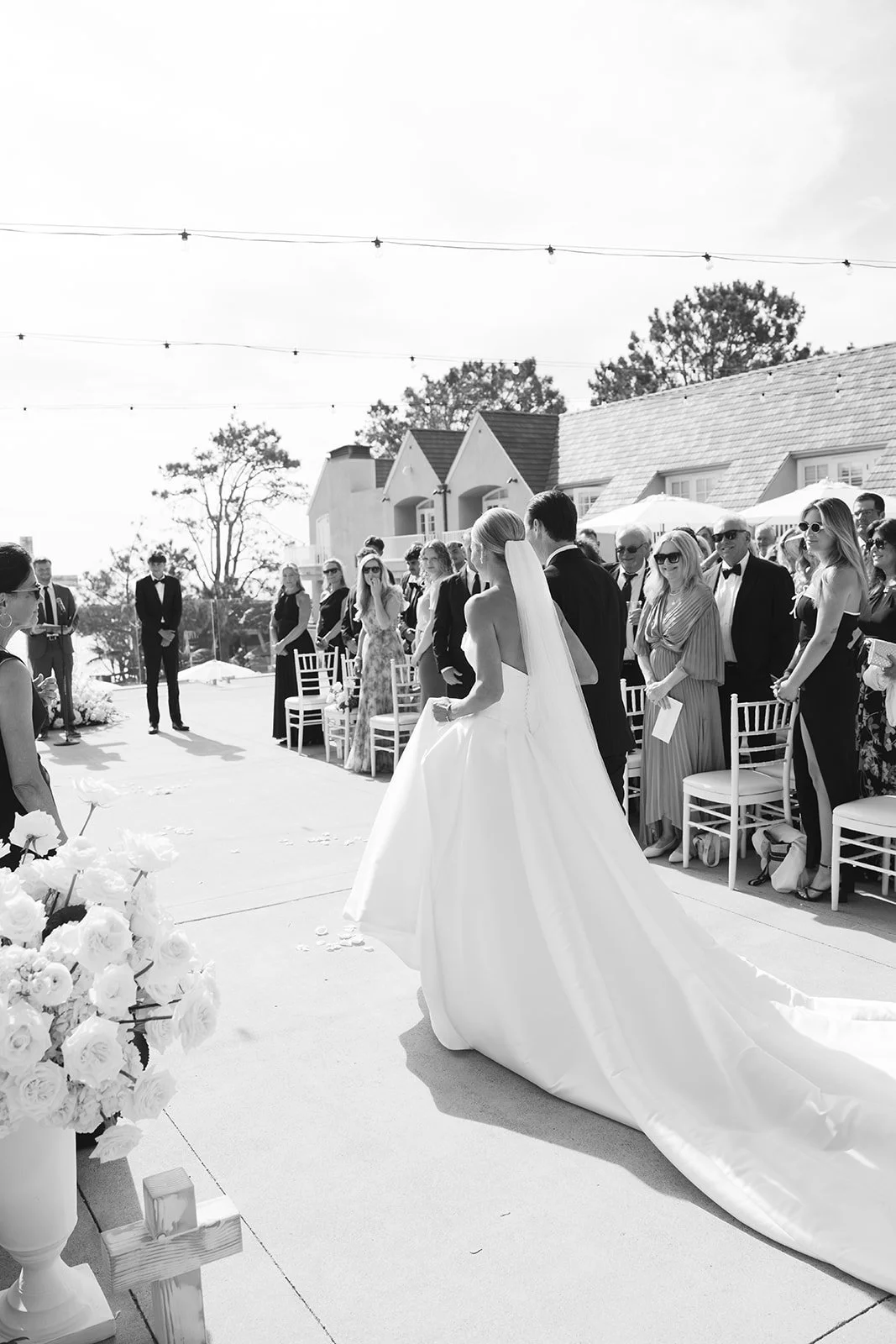 The bride and father of the bride walking down the aisle.