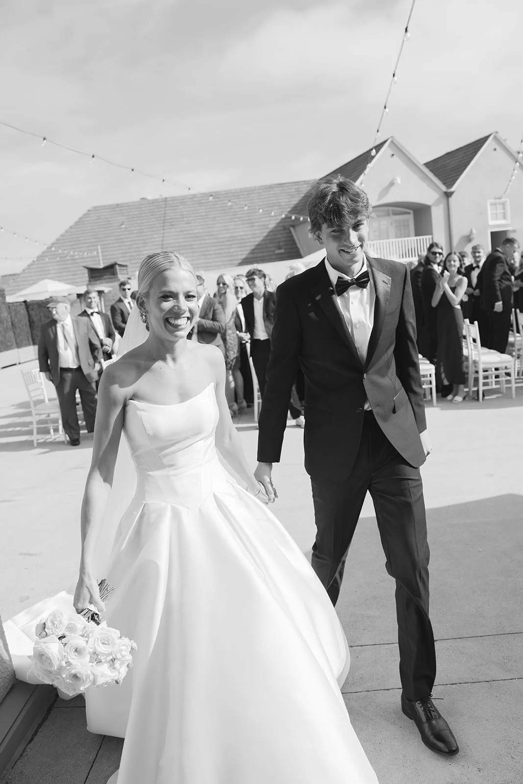 The bride and groom holding hands