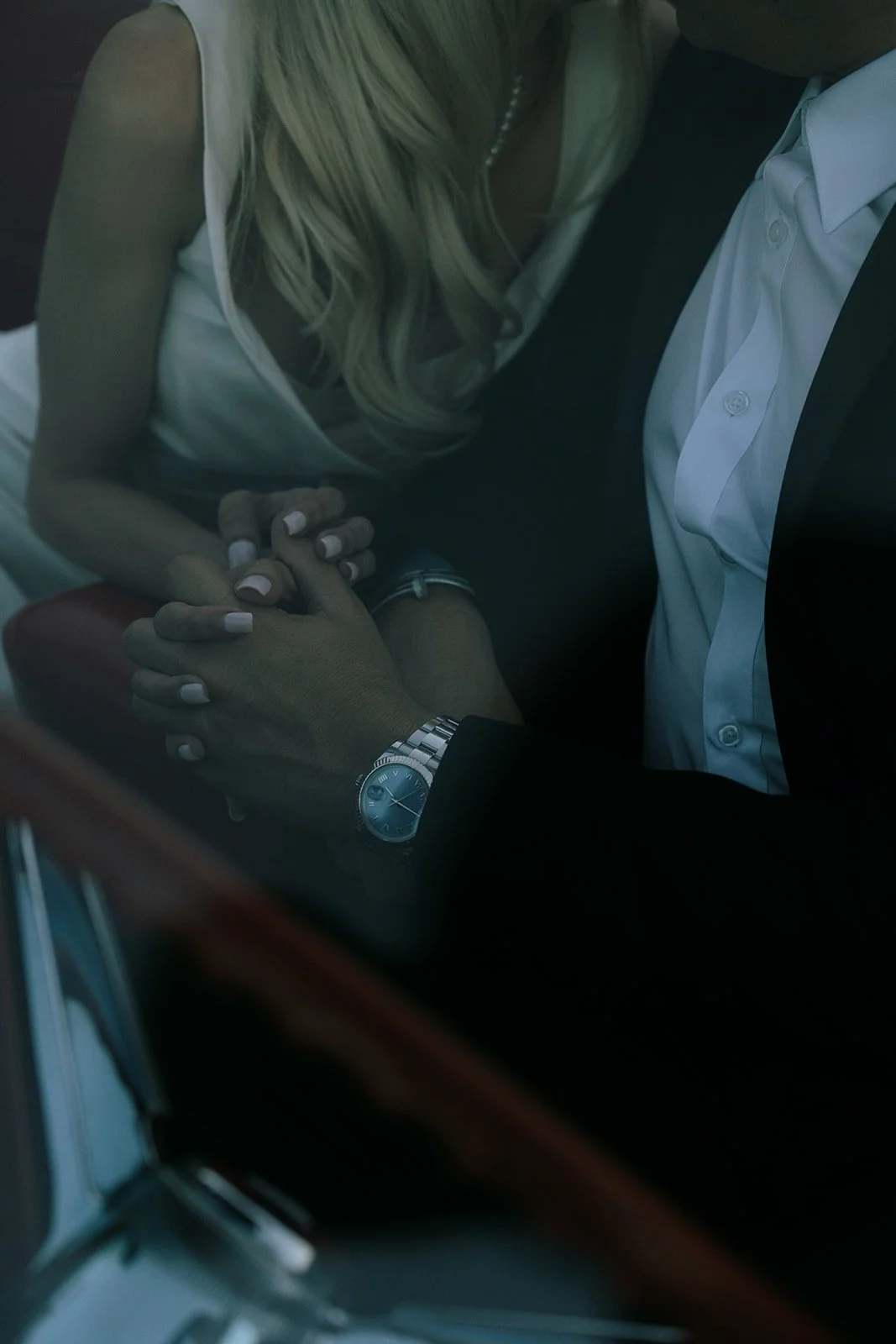 The bride and groom holding hands