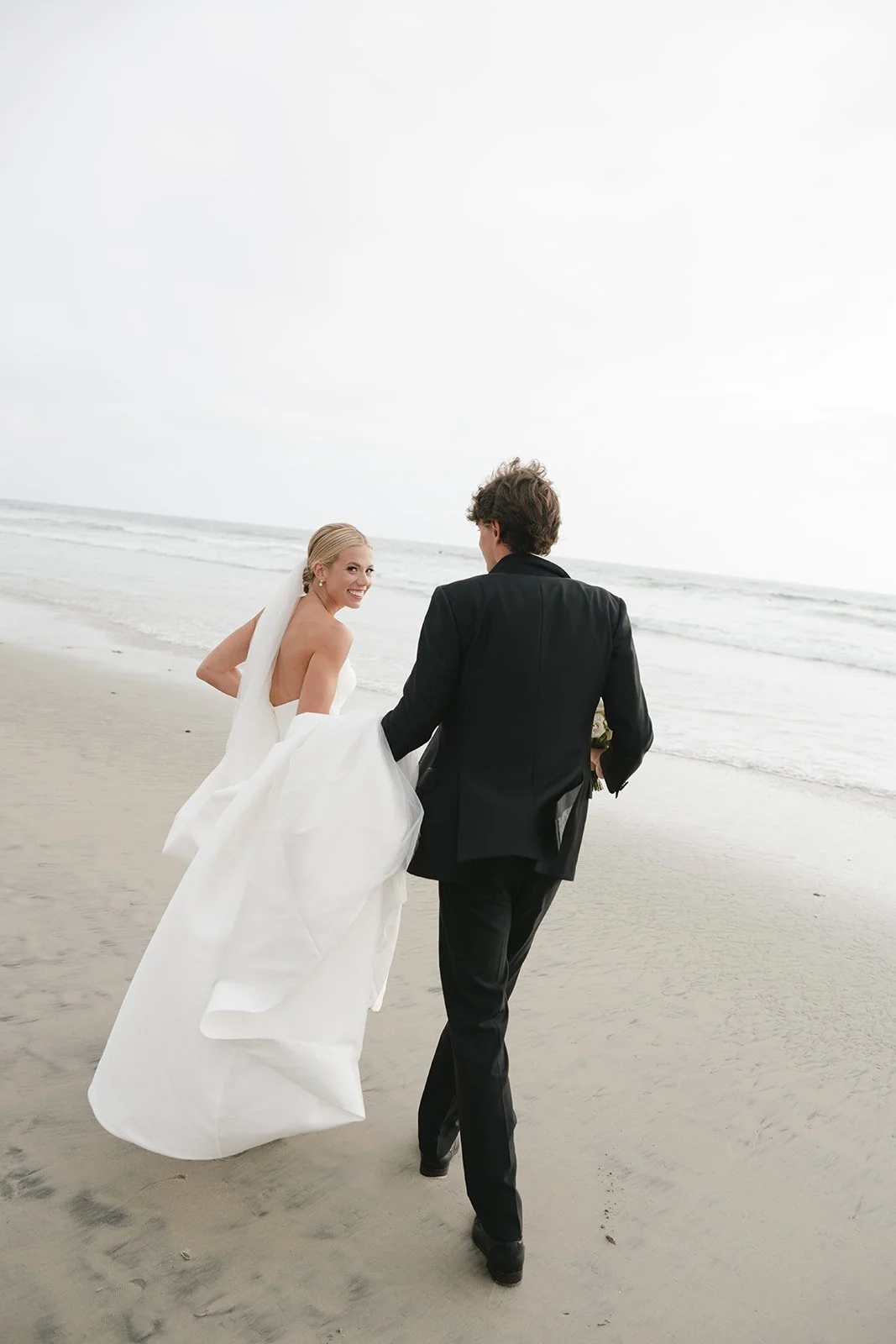 The bride and groom on the beach