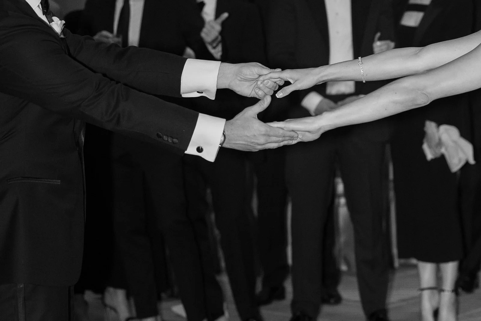 hands touching bride and groom candid wedding phots romantic black and white editorial wedding photos