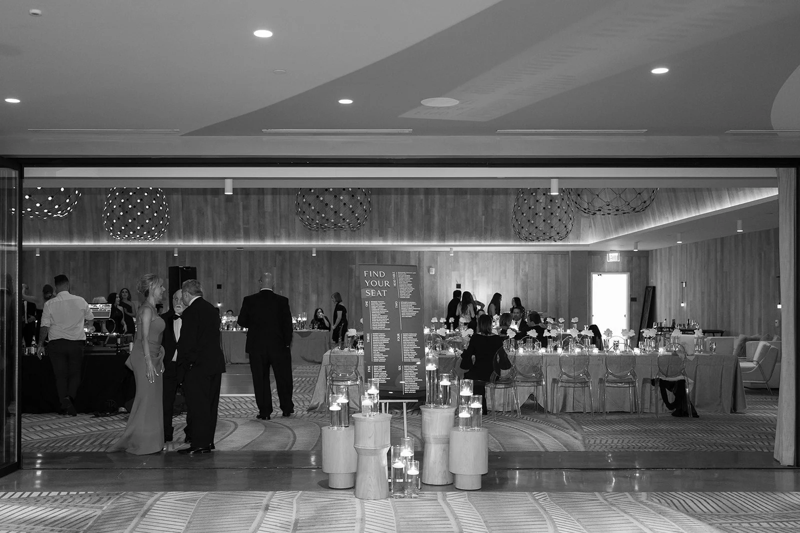 symmetrical modern luxury wedding photography: reception hall empties as guests leave