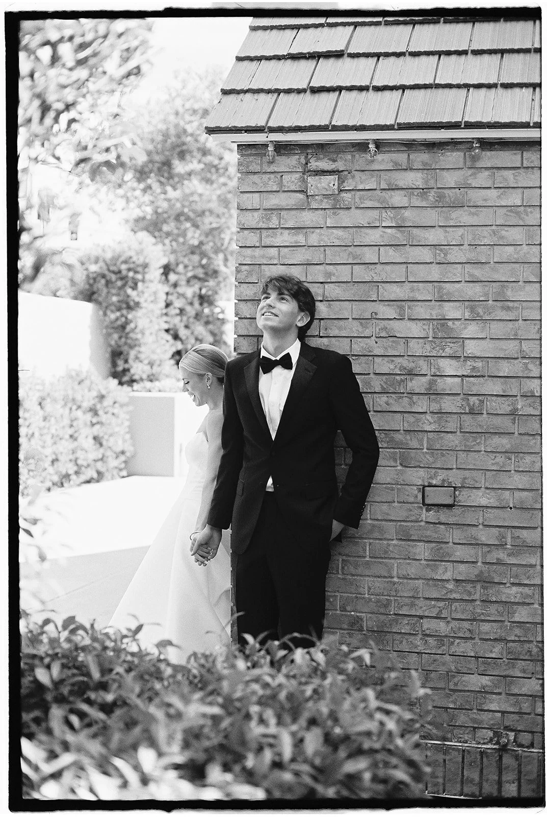 The bride and groom holding hands