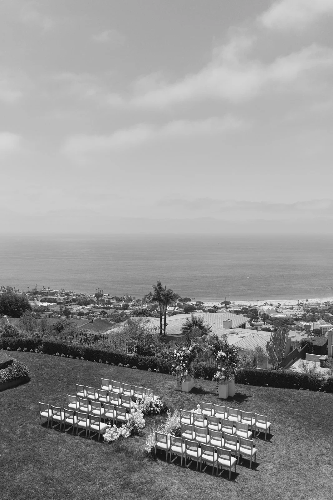A drone shot of the ceremony and the ocean