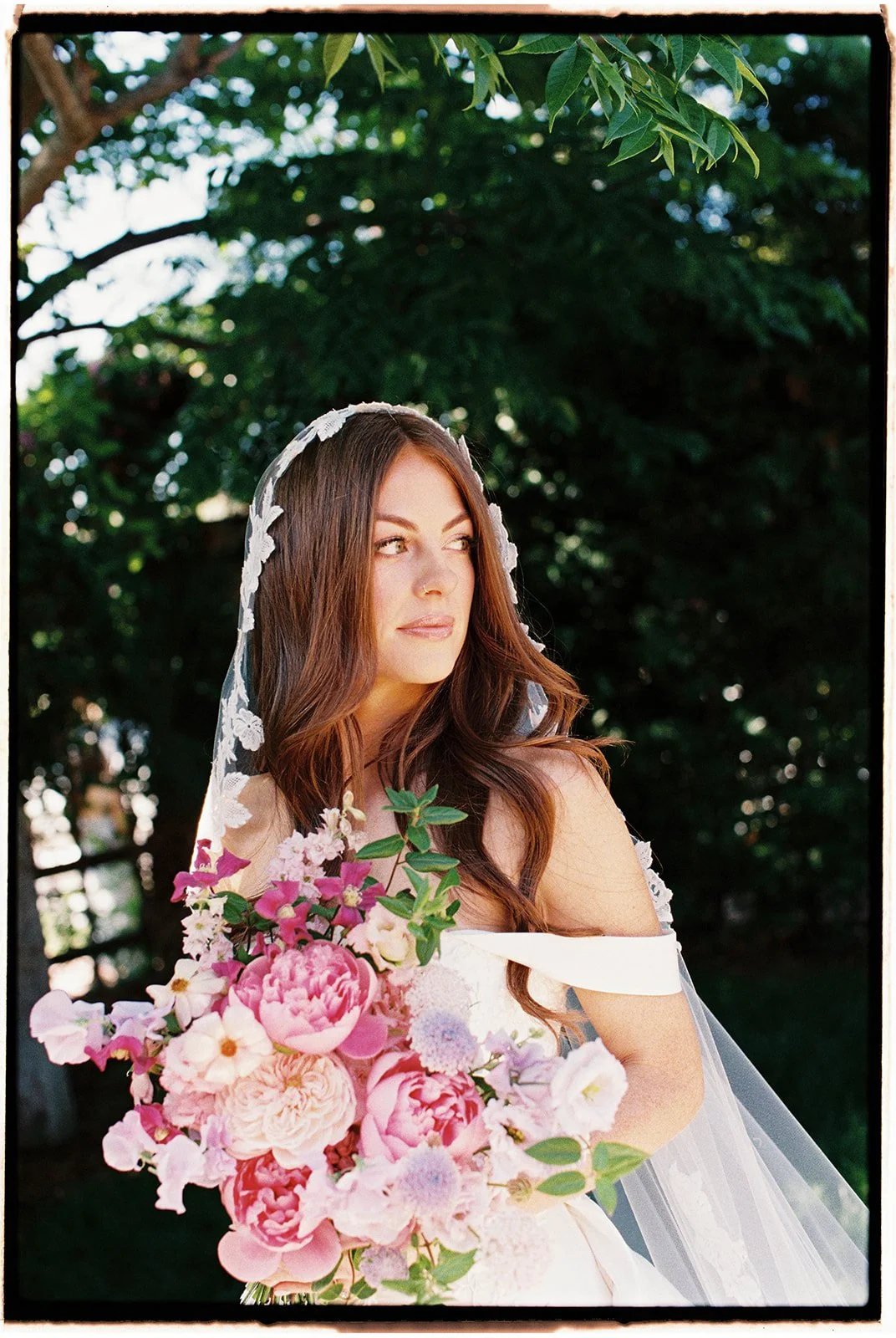  The bride looking out into the distance. 35 mm film. 