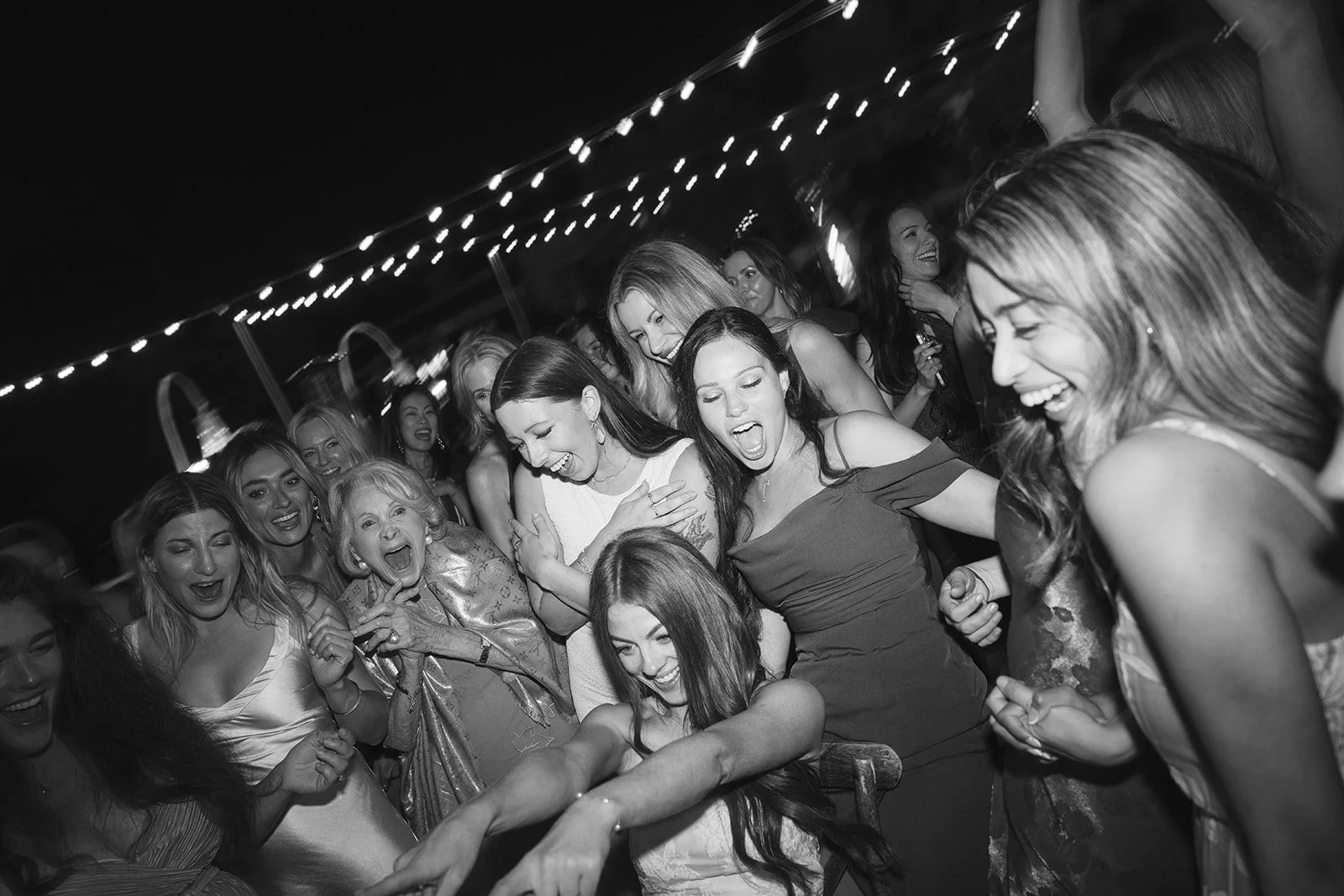  Candid dancing moments: the bride and her loved ones. Digital.  