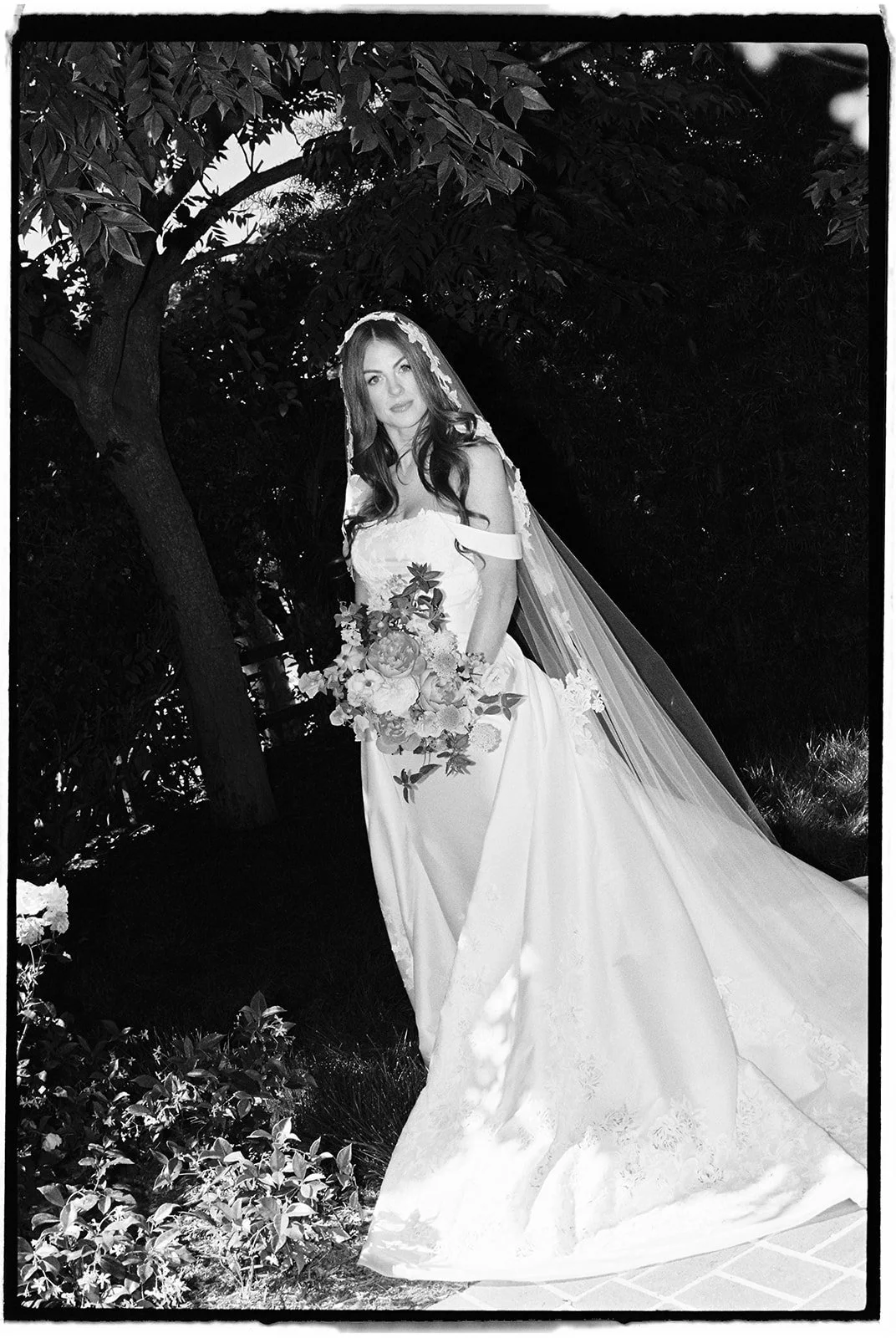  A portrait of the bride in her final wedding look. 35 mm film. 