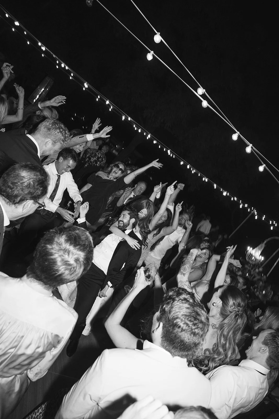  The bride and groom are the stars of the show in the middle of the dance floor.  