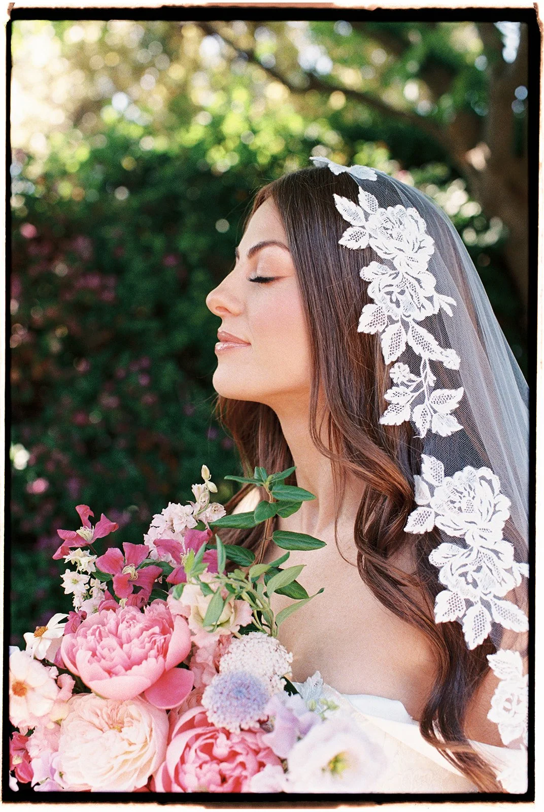  The elegant lace on full display in this bridal portrait. 35 mm film. 