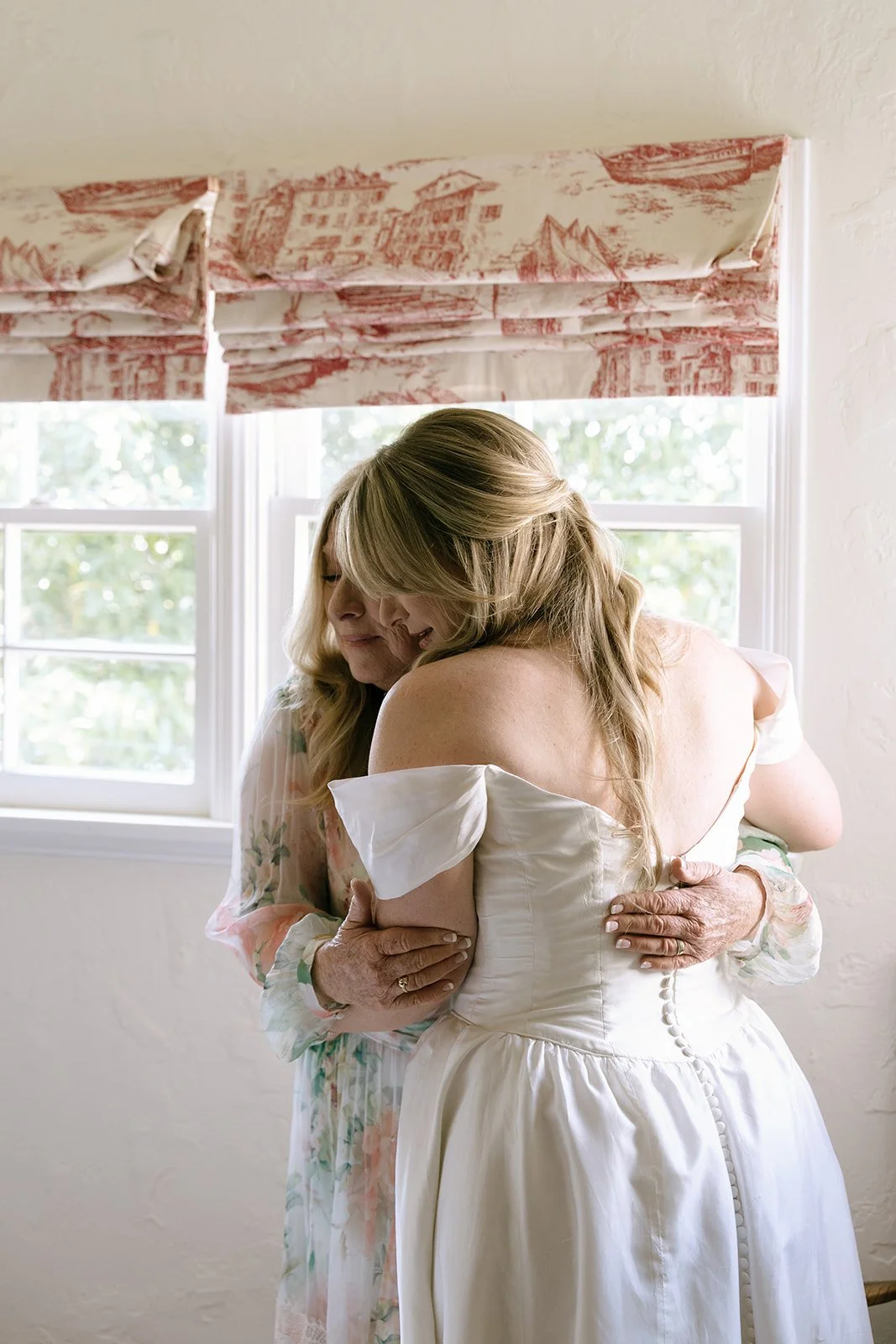 A hug with bride and Mom. Digital.