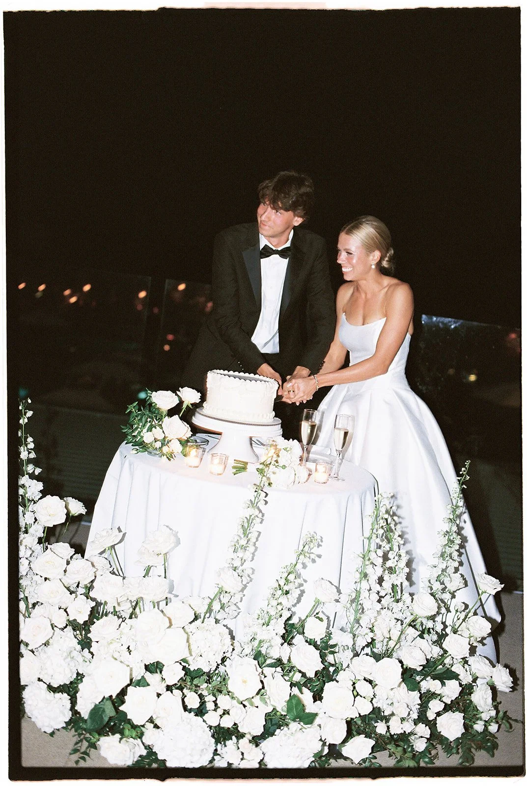 bride and groom cutting their wedding cake.