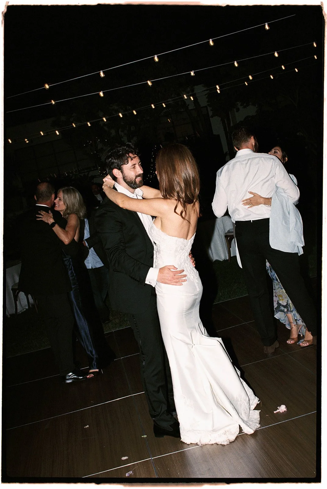  Anniversary dance: All of the happily married couples join the bride and groom on the dance floor. 35 mm film.  