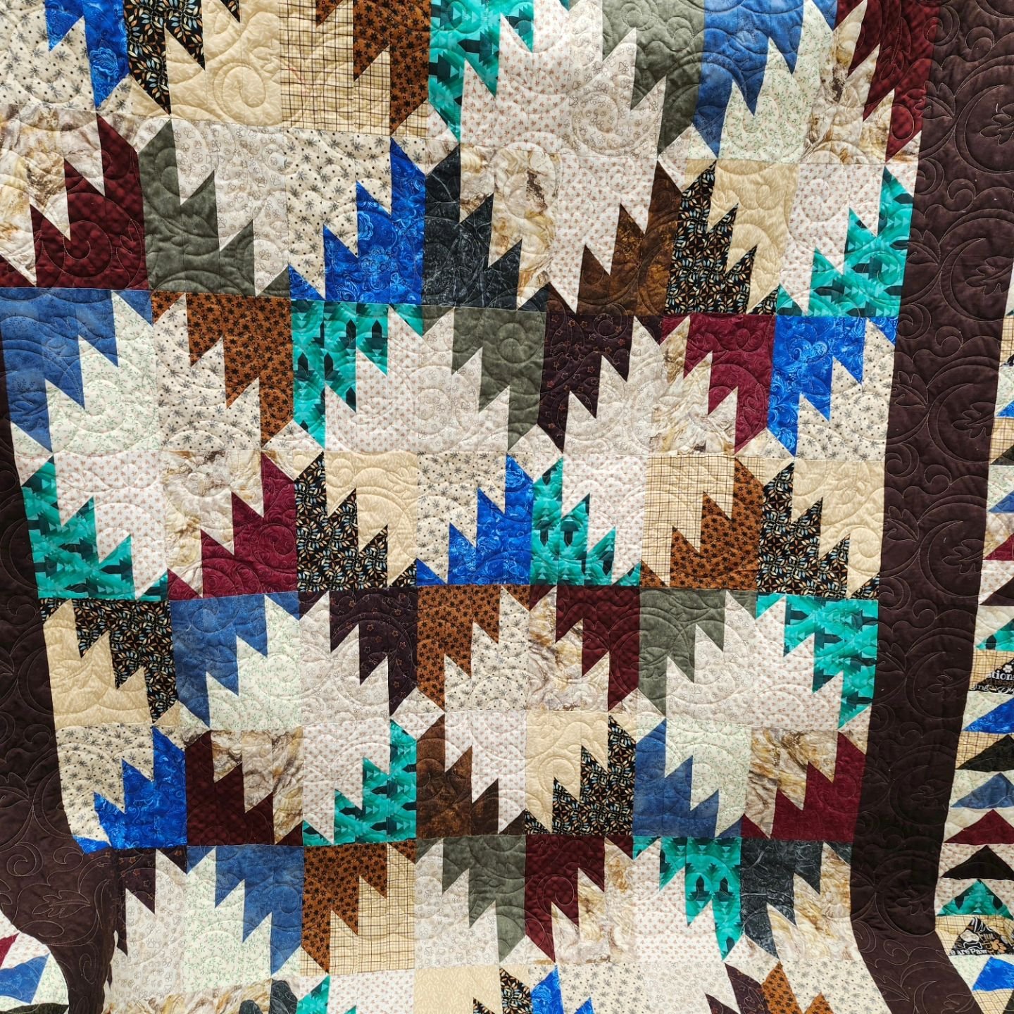 Jill was in today to longarm this awesome Delectable Mountain quilt.  She chose a pattern called 'leaves-in-the-wind' to finish it  ##longarmmachinerentals ##quiltfun ##quiltyourselfawesome ##quilting ##gammillstatlerstitcher ##topstitchery
