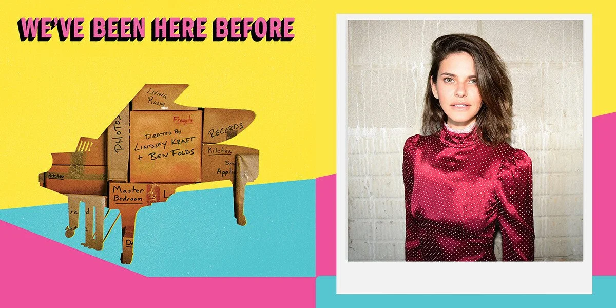 Promotional banner for “We’ve Been Here Before” featuring a cardboard piano labeled with room names on a bright yellow, pink and blue background, alongside a portrait of a woman in a red polka-dot blouse standing against a light brick wall.