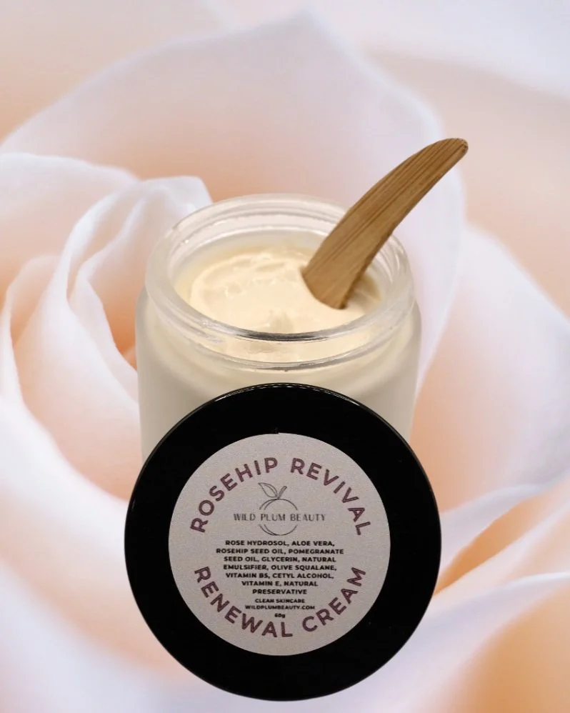 rosehip revival facial cream for fading pigmentation and dark spots on a rose background