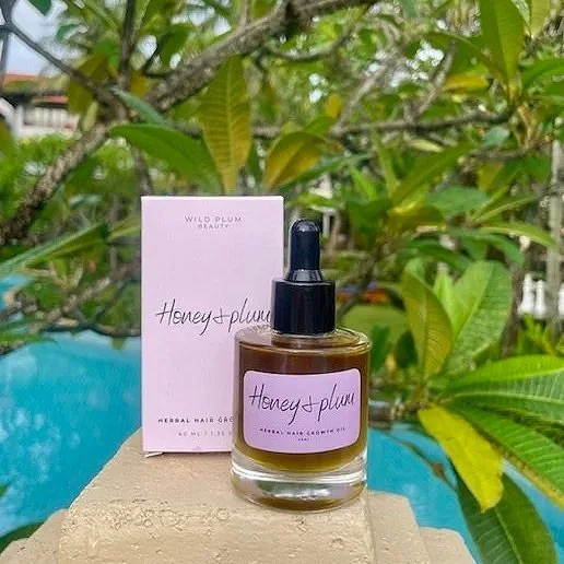 Honey & Plum Hair Growth Oil made with natural botanicals to support healthy hair growth, scalp hydration and reduced breakage