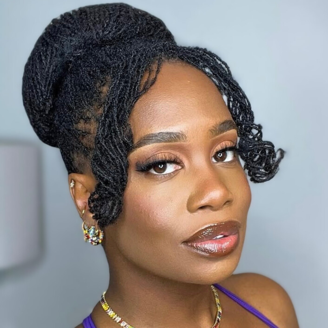 woman with microlocs and donut bun