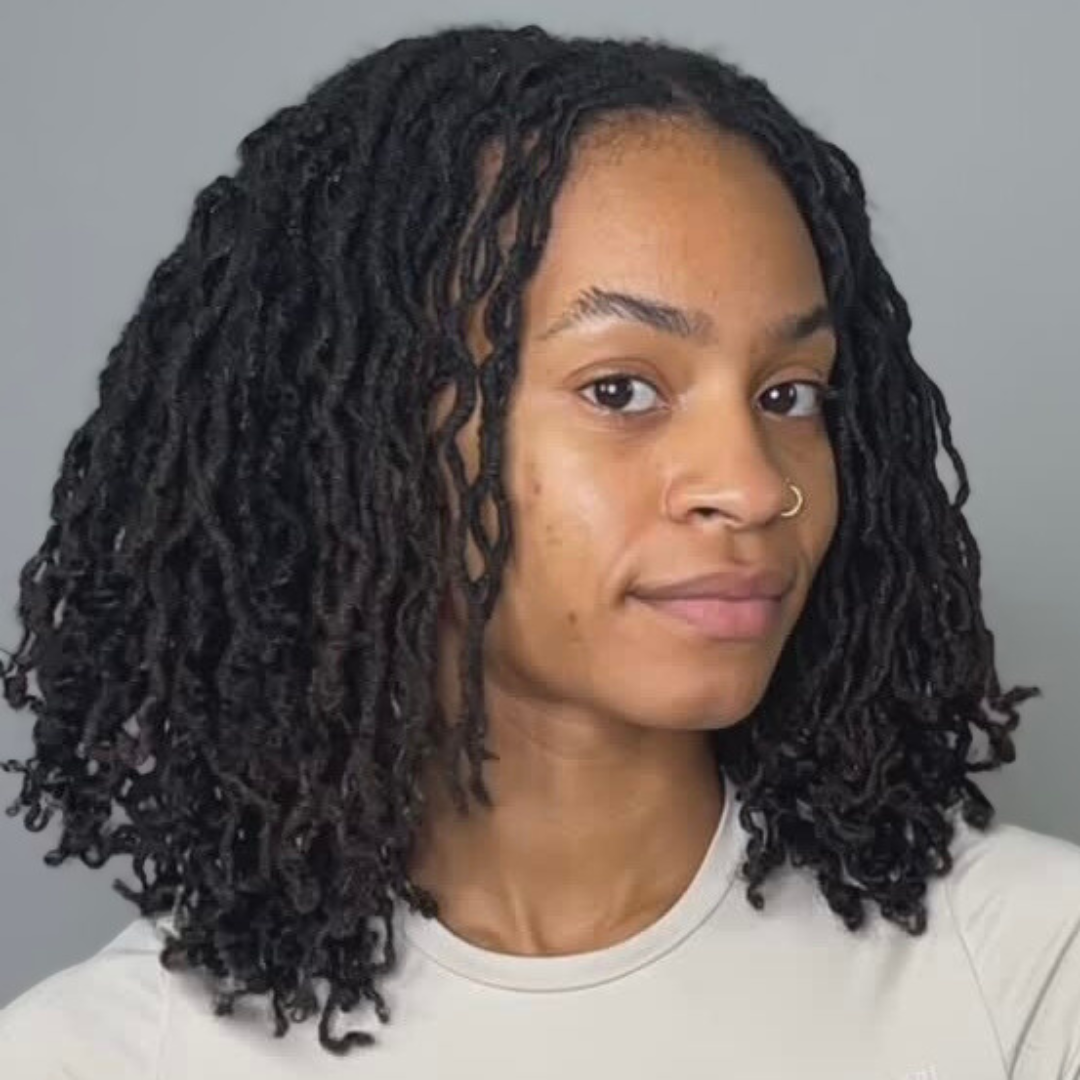 woman with microlocs and clip-in extensions