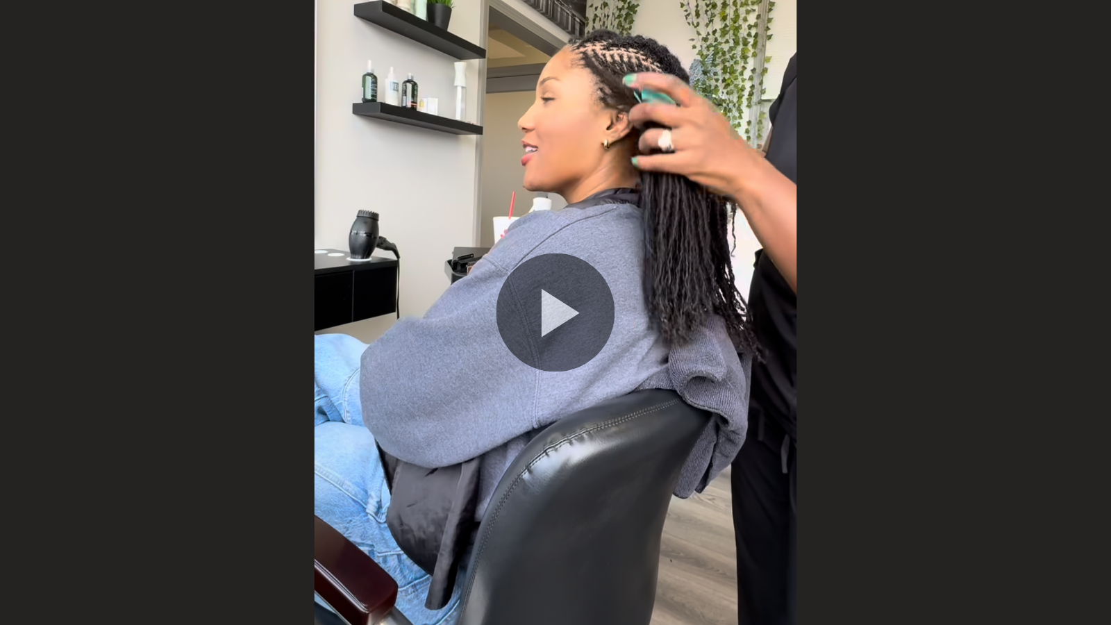 woman with microlocs and jumbo cornrows