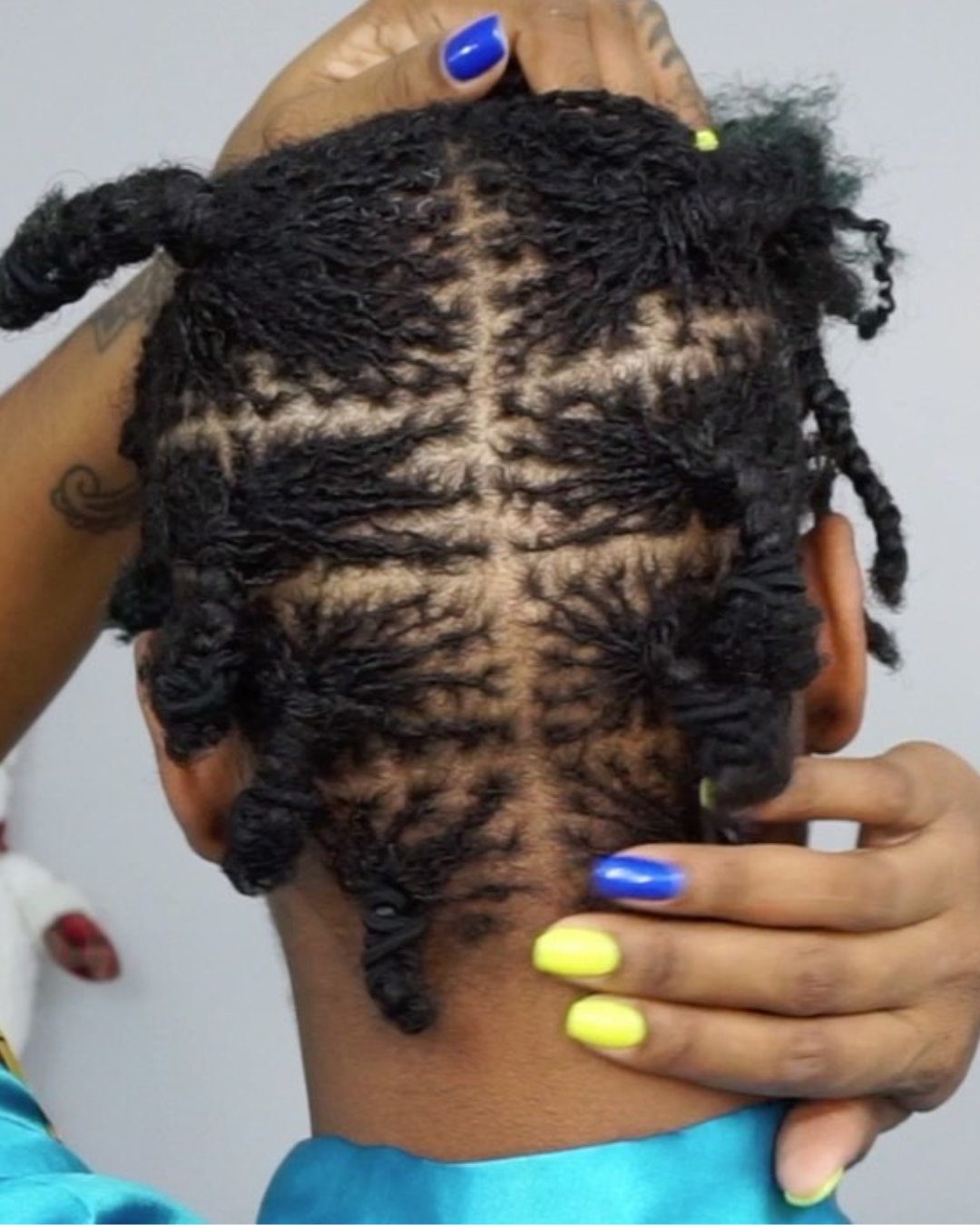  woman shampooing microlocs 