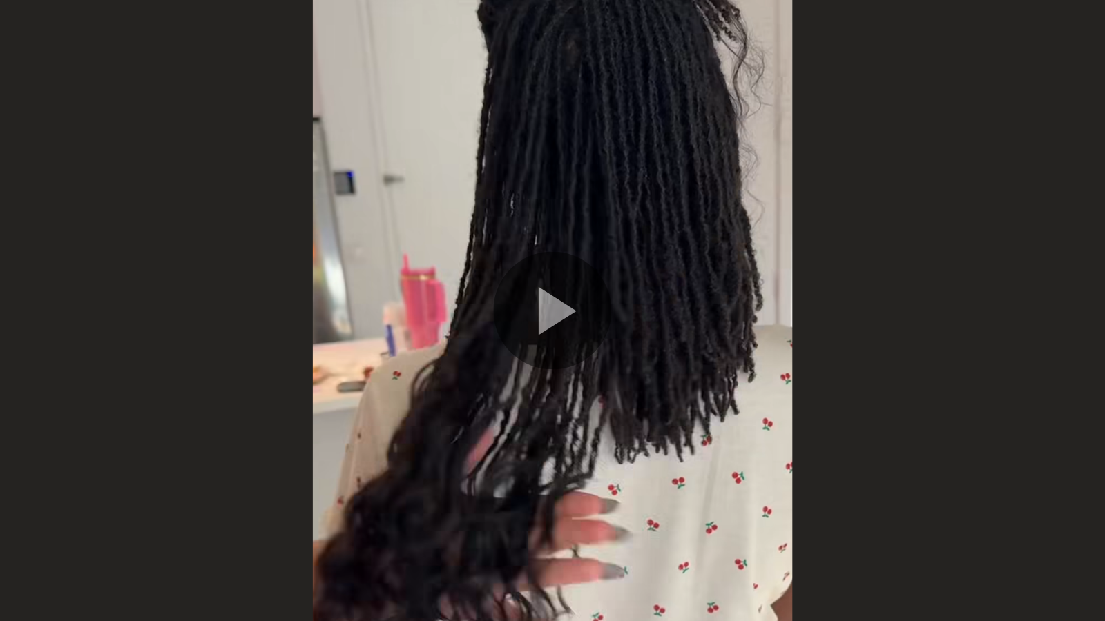 woman with microlocs and boho extensions