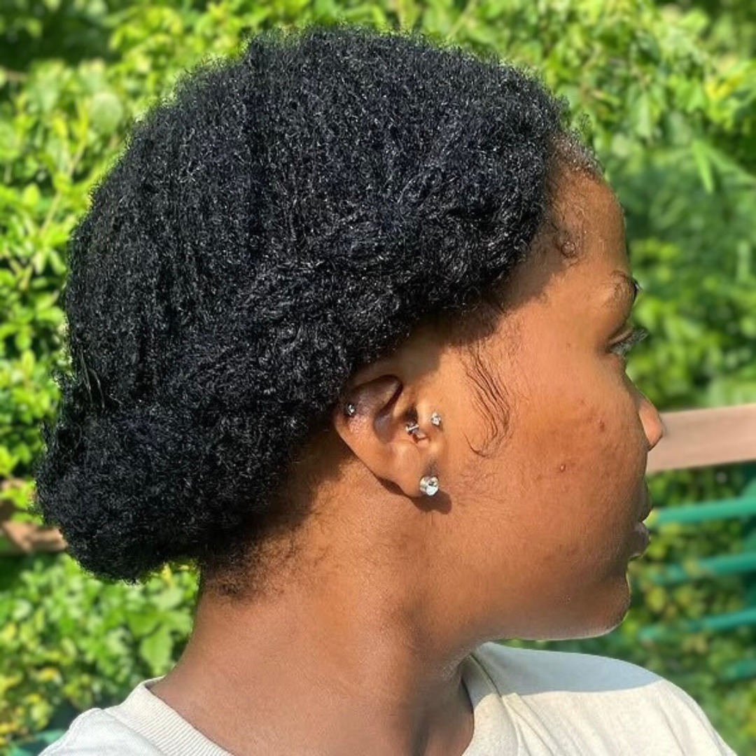woman with microlocs and halo crown braids