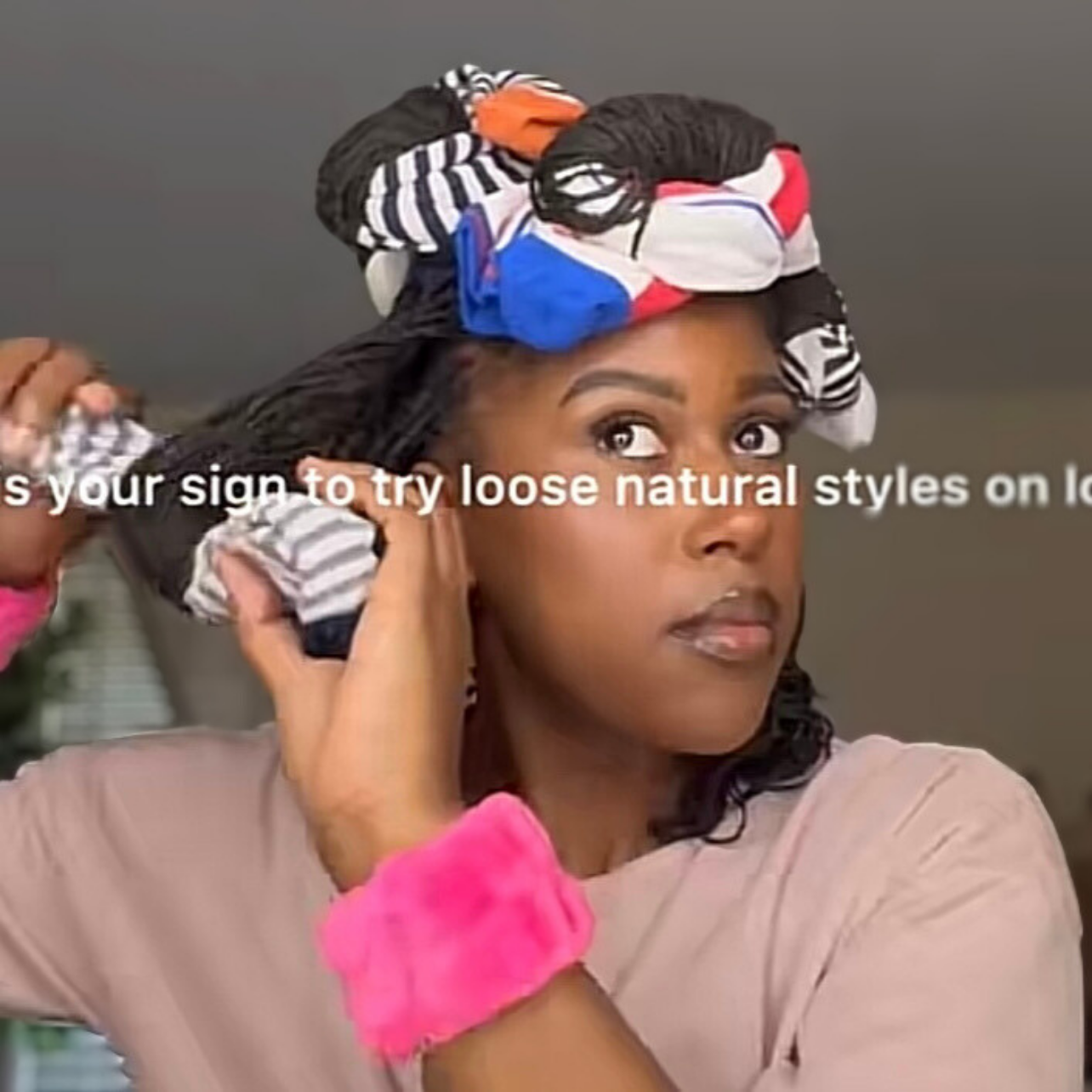 woman with microlocs and sock curls