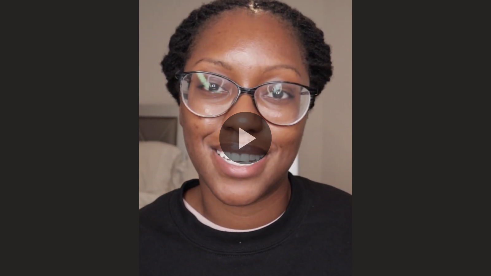 woman with microlocs and barrel rolls updo