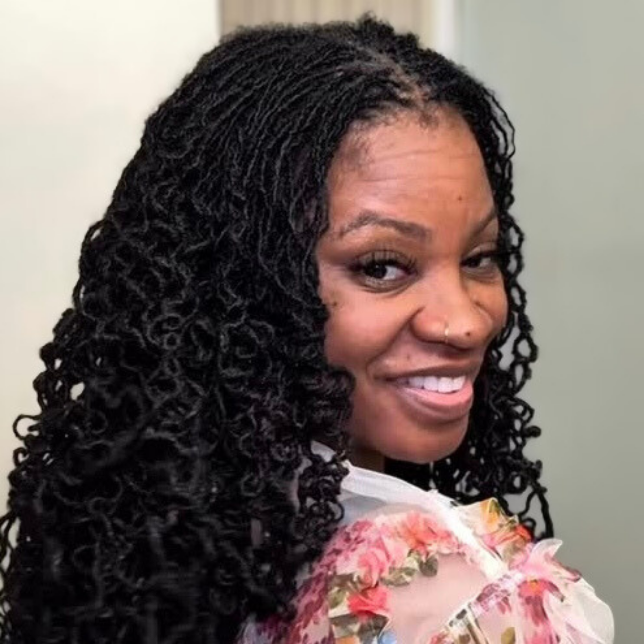 woman with microlocs and barrel curls