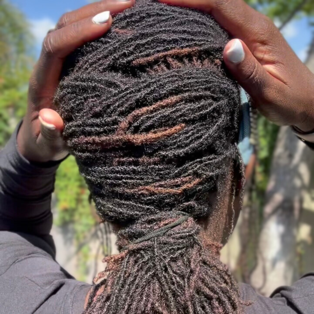 woman with microlocs and french fish braid