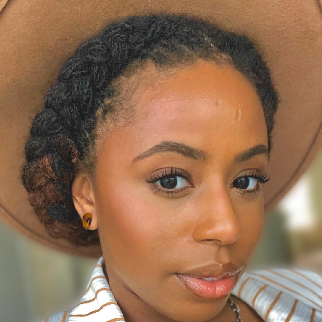 woman with microlocs and halo braids 