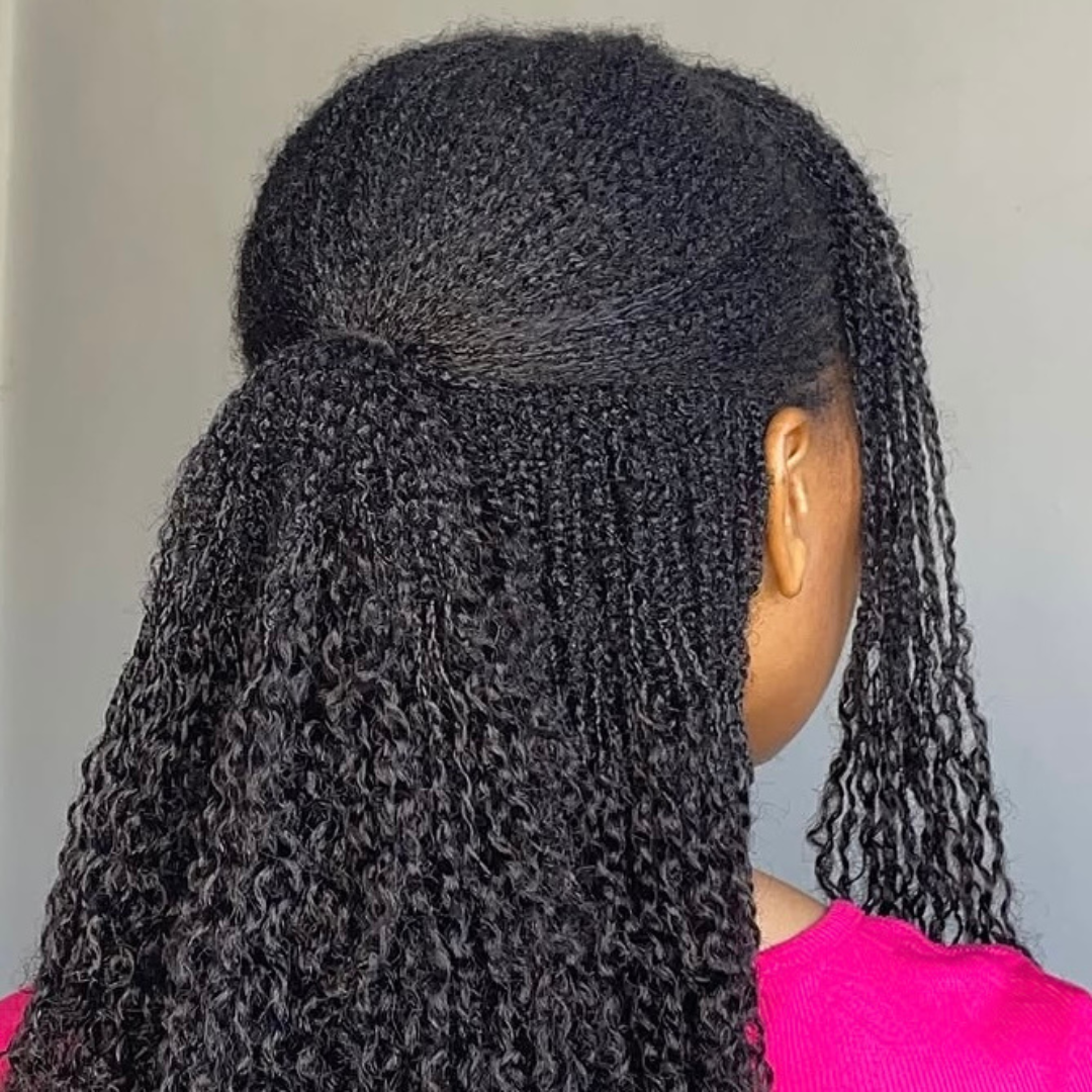 woman with microlocs and braid extensions