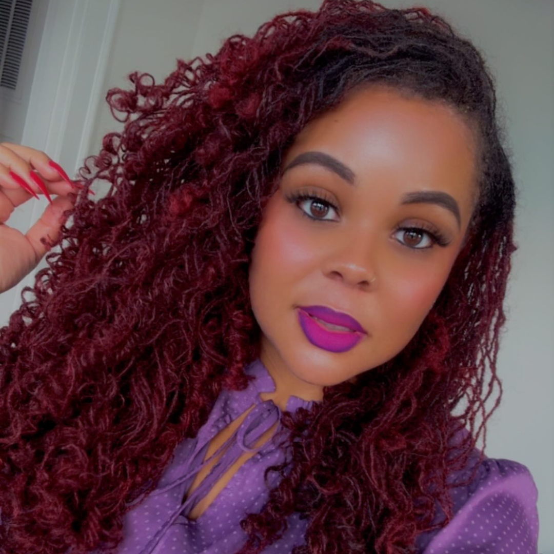 woman with long microlocs pipecleaner curls