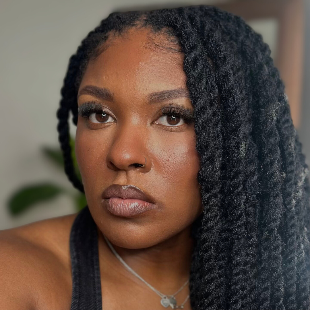 woman with microlocs and cuban twist extensions