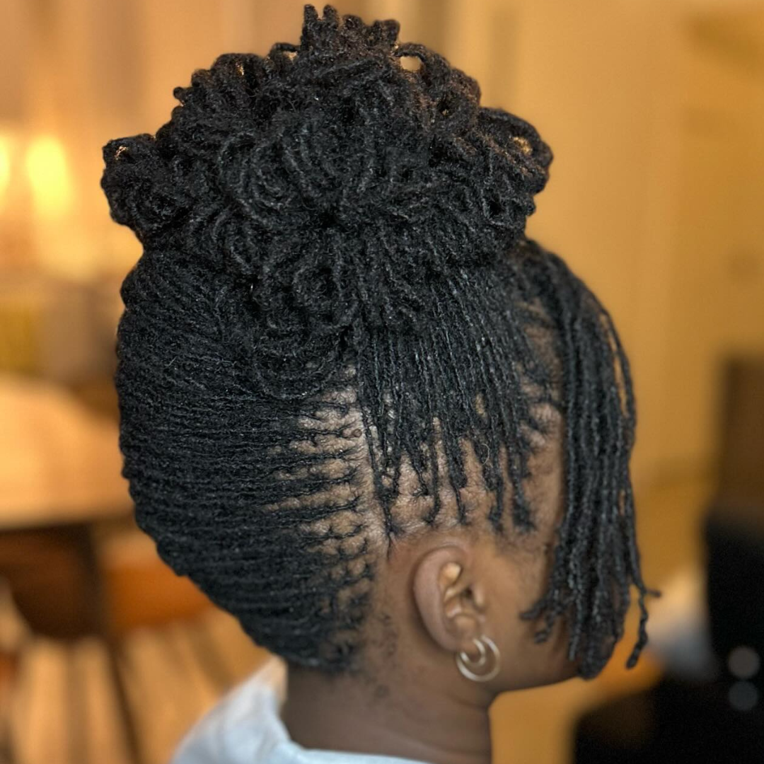 woman with microlocs high bun bridal / wedding hairstyle