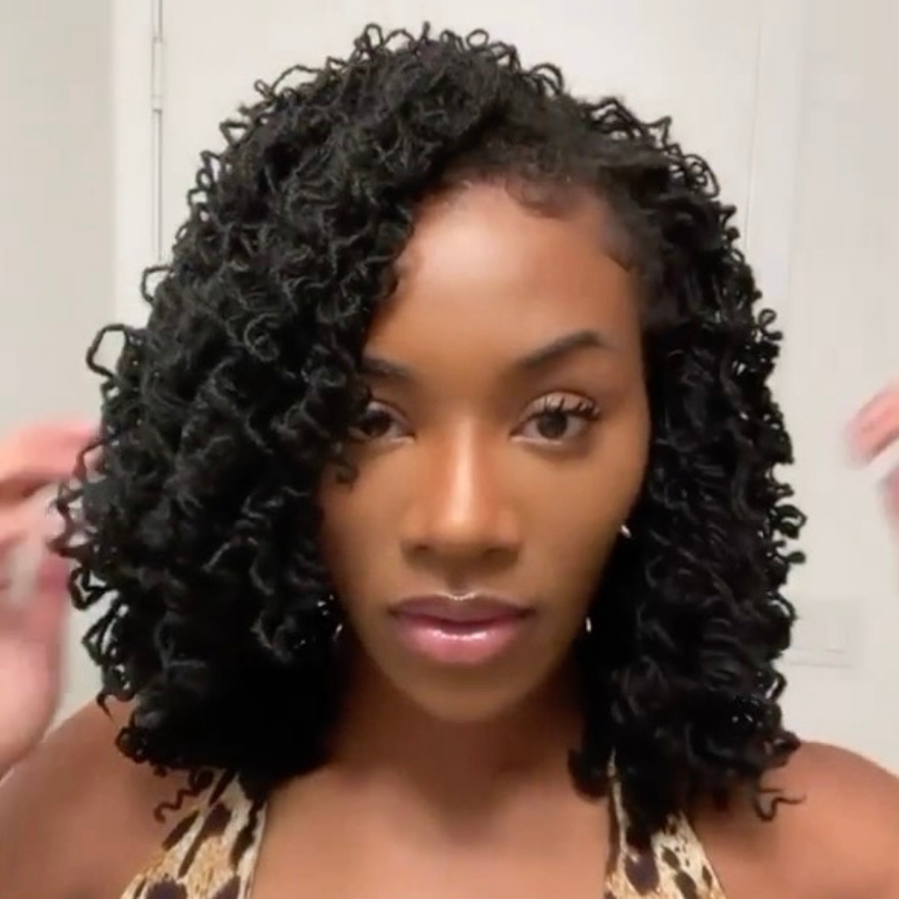 woman with microlocs and pipe cleaner curls